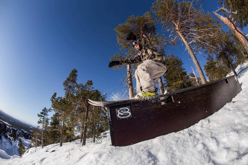 An Alpine skier jumps out of a jump.